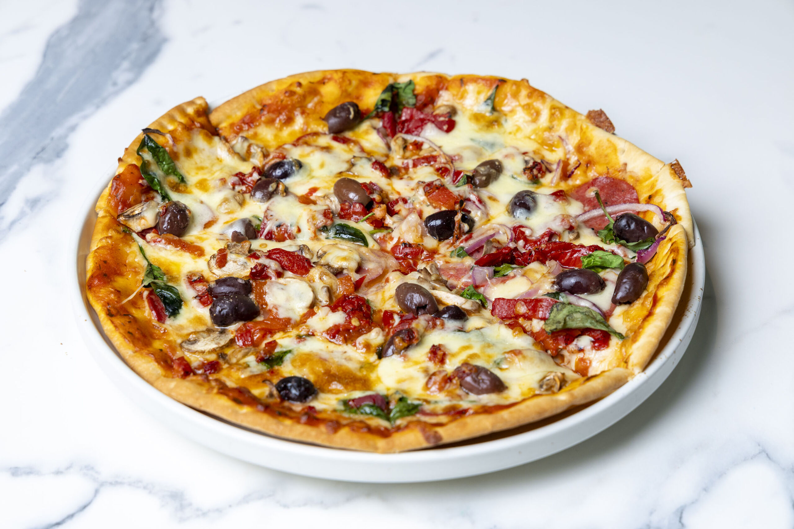 Supreme Pizza at Essence Restaurant